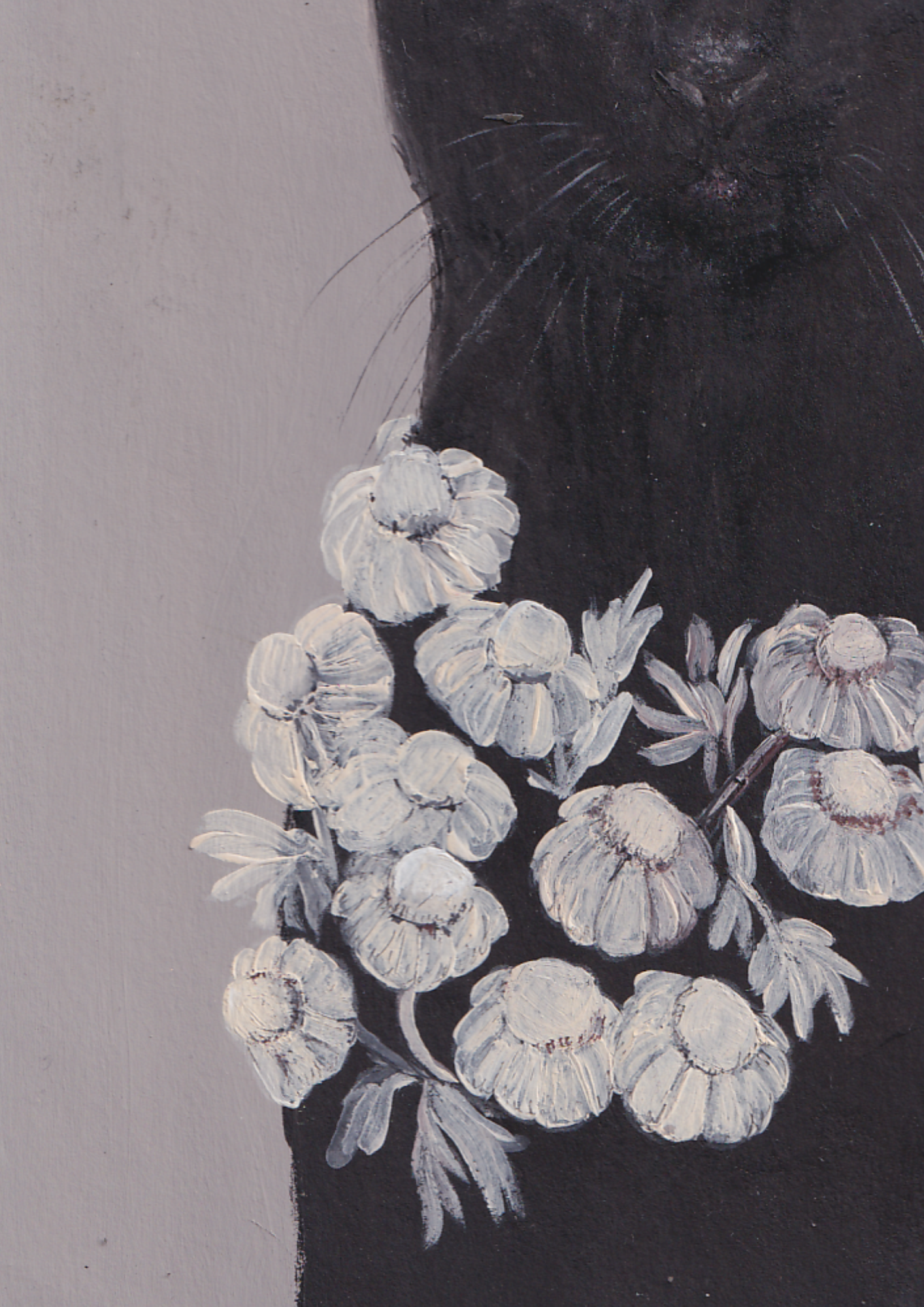 Chat noir et couronne de fleurs