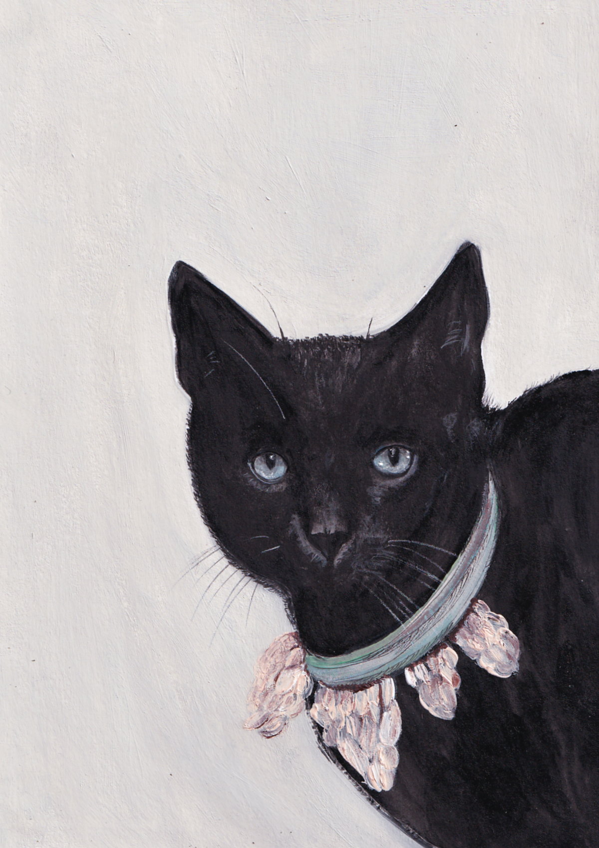 Chat noir et sa couronne de pommes de pin