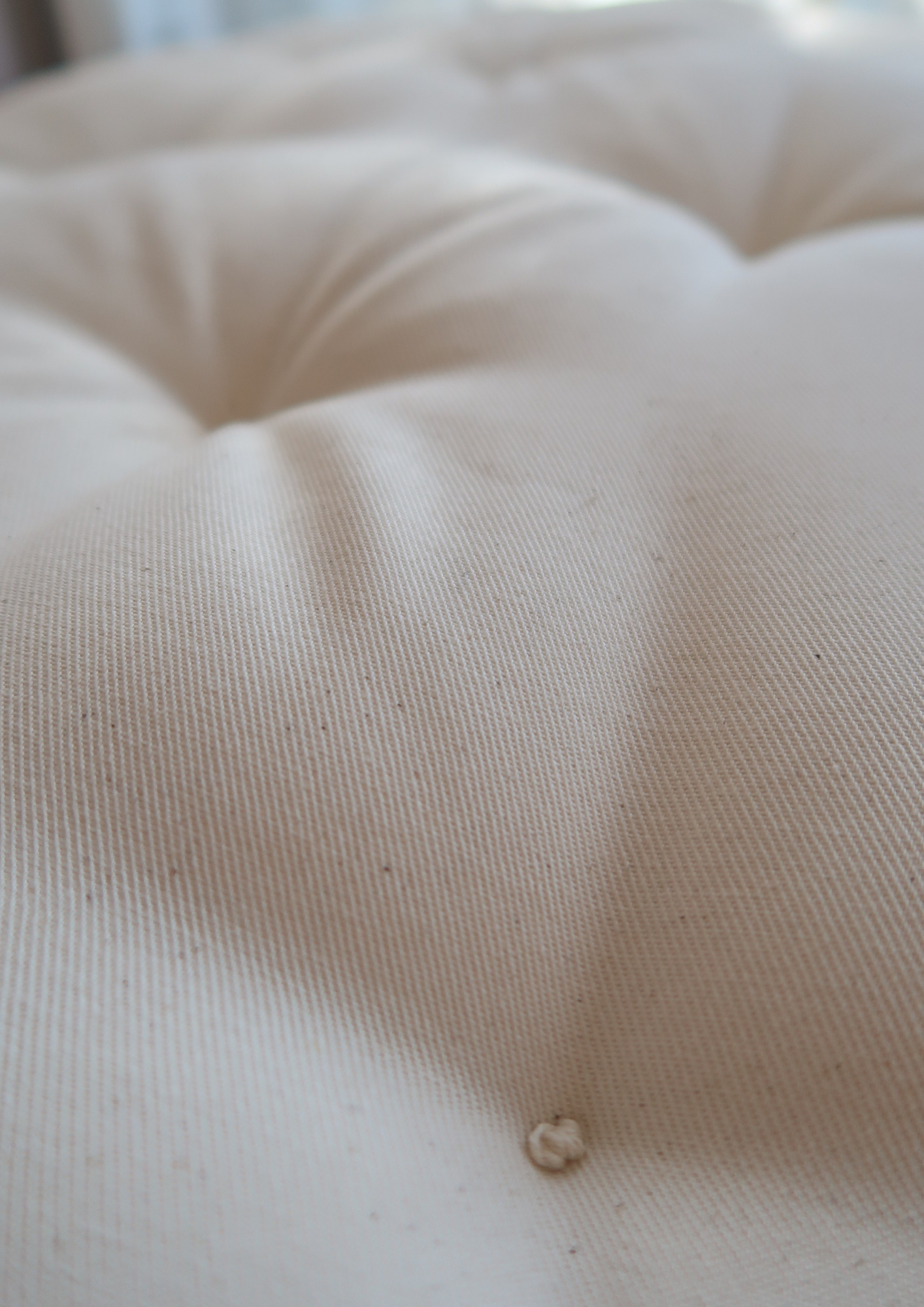 Grand coussin capitonné naturel 1m05