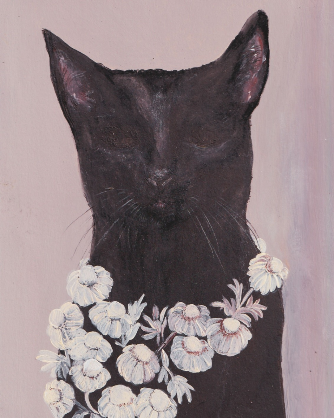 Chat noir et couronne de fleurs